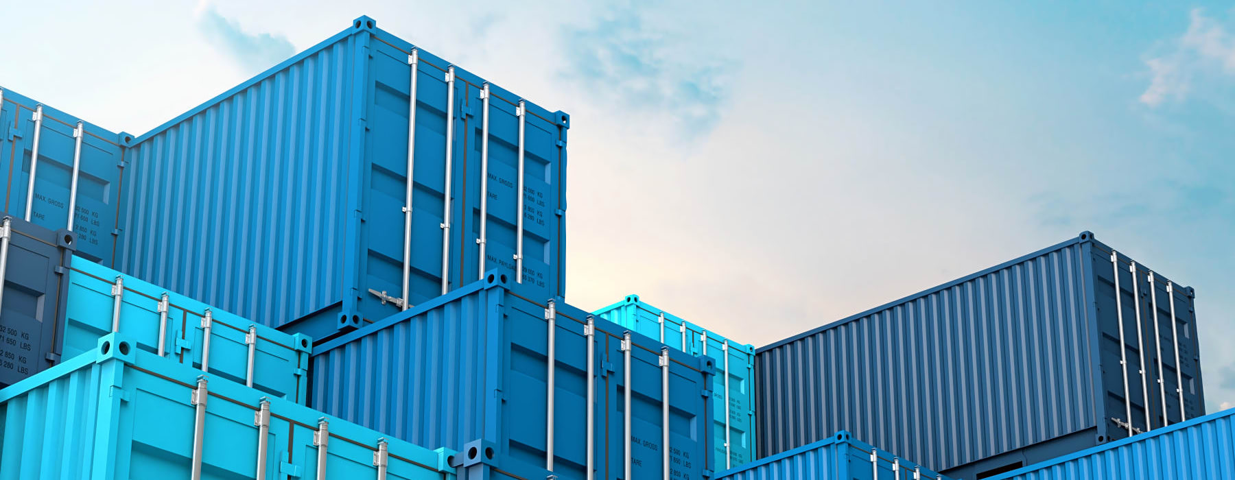 A view of several blue 1st Move International shipping containers stacked