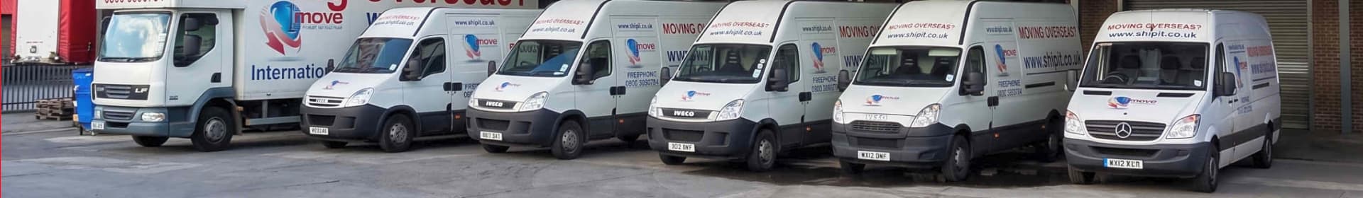 1st Move International removal vans lined up outside the company's warehouse and headquarters