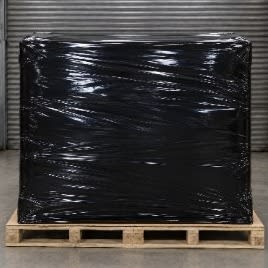 Pallet sealed in black Shrink-Fast film after heat treatment.