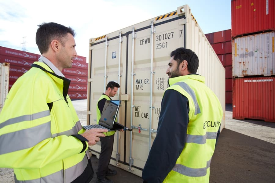 Couple reviewing customs paperwork on a laptop