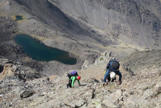 Ascending easy slabs north of the ridge