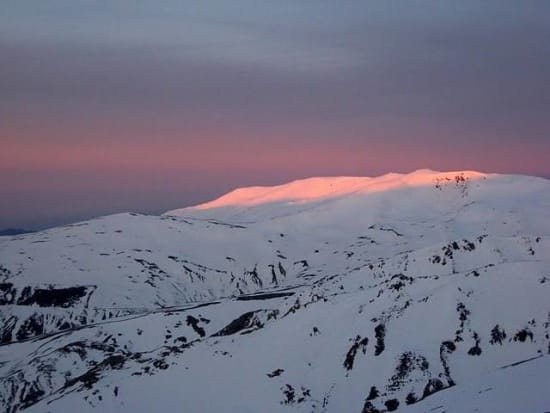 Changing light hits the upper slopes of Tajos de los Machos