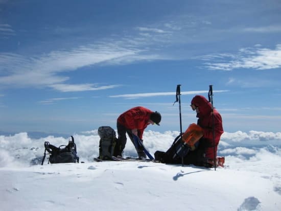 Removing skins for the descent back down the mountain