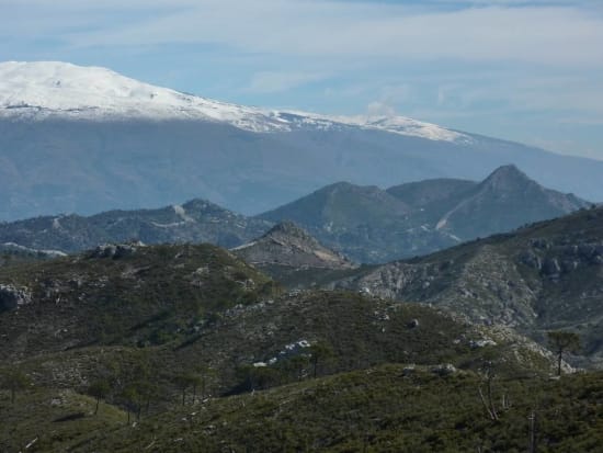 The peak of Giralda dwarfed by Cerro Caballo