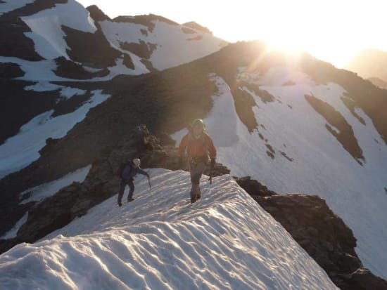 The sun arriving as we start the ridge