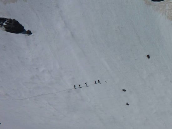 The group crossing snows below the ridge