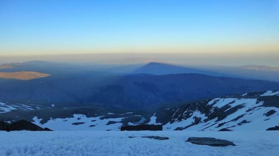 The late afternoon cast the long shadow of the mountain far over to the east towards Almeria