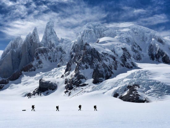 Walking in front of the west face of Cerro Torre, Cirque de las Altares