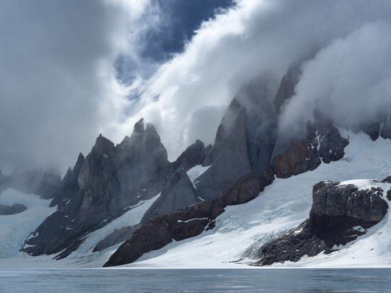 Cerro Torre west face covered in cloud