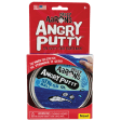 Crazy Aaron’s Angry Putty, Stress Ball in packaging. The red, rectangular shaped, paper packaging shows the large, round, silver tin peeking through the bottom. The tin lid sticker has a blue background with dark blue squiggles. There is a stressed face with splashing sweat beads drawn over a band of putty, stretched across the label. You can see small, silver, rectangle and circle shaped glitter inside the dark blue putty. Text on the package reads “The more you stretch, the stronger it gets.”