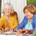 Senior Woman Playing Game with Friends