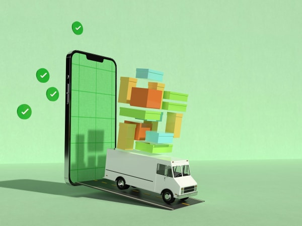 A mobile phone with a delivery truck coming out of it with several packages hovering above