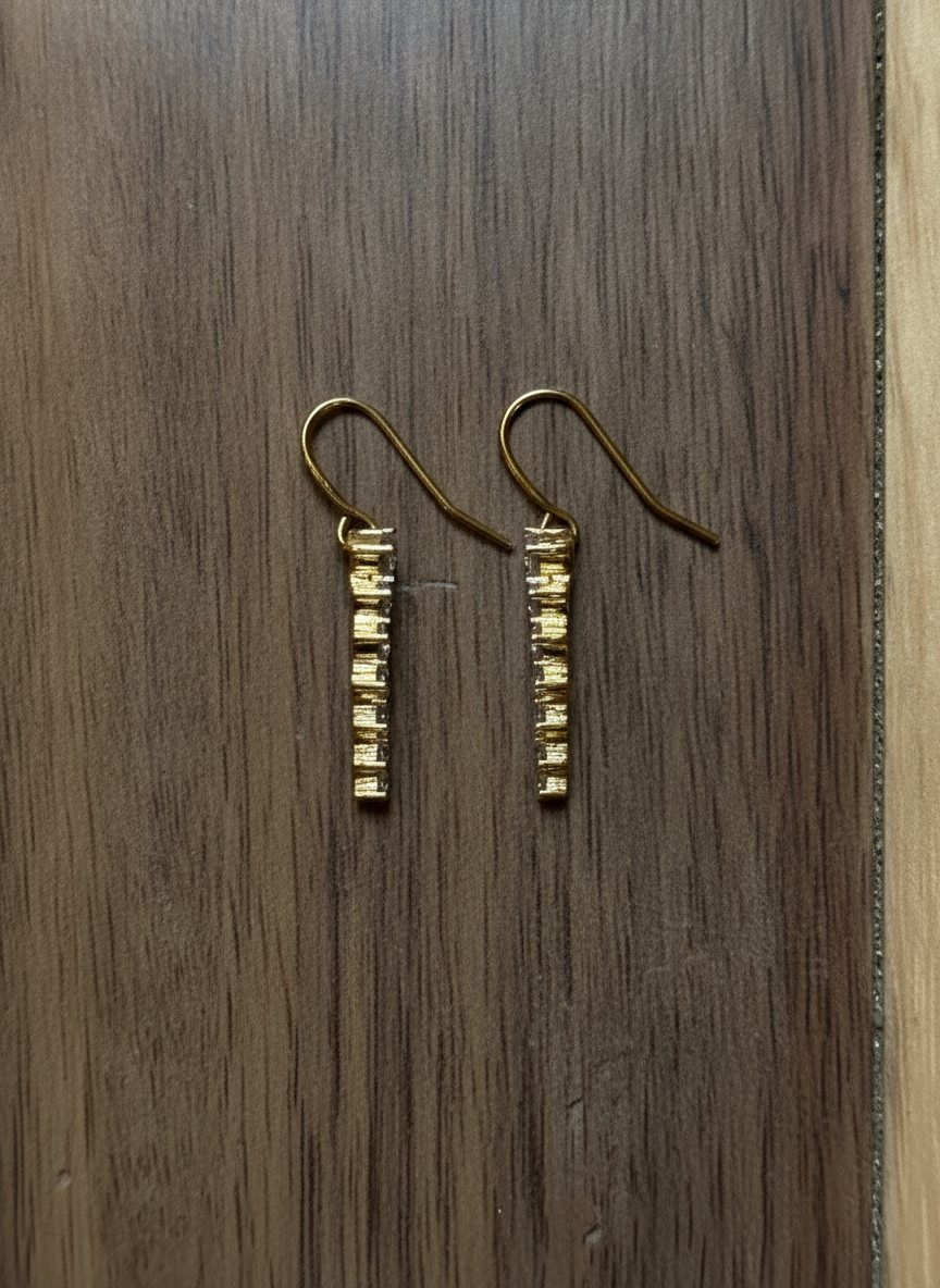 Elegant Gold Dangling Earrings - Styled Flat-Lay