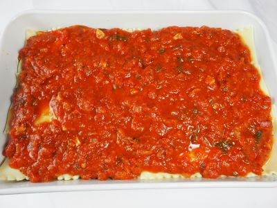 Cover the Top Layer of Noodles with Spaghetti Sauce