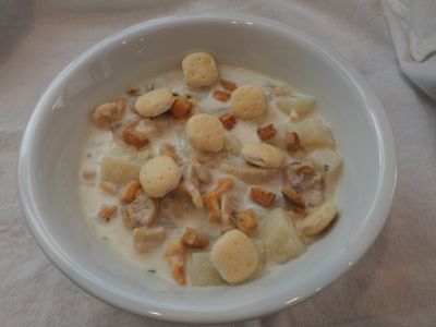 Bowl of Clam Chowder with Oyster Crackers and Fried Salt Pork Bits