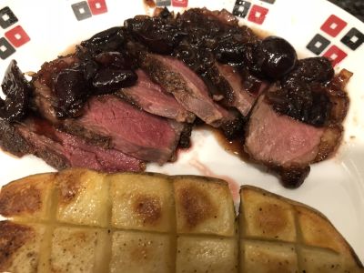 Duck Breast with Cherry Sauce Served with a Roasted Potato