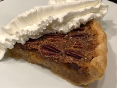 Slice of Pecan Pie with Whipped Cream