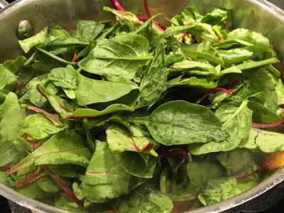 Add Half the Greens to the Pan