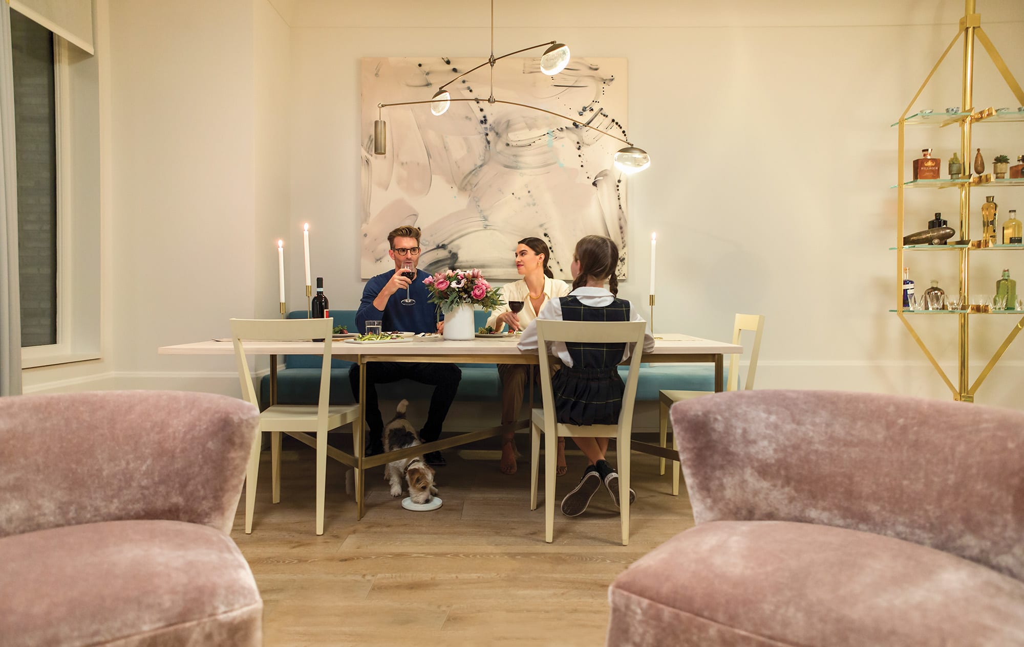 Family dining in bright dining room at 180 East 88th Street, a luxury condominimum on the upper east side of Manhattan. 