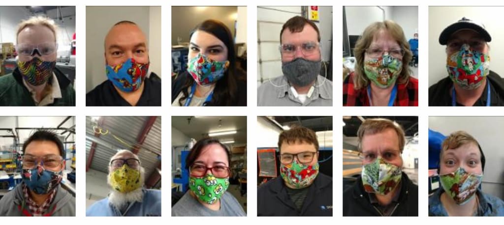 sigmadesign employees with masks