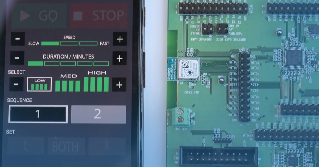 PCB with cell phone showing wireless technology developed by SIGMADESIGN.