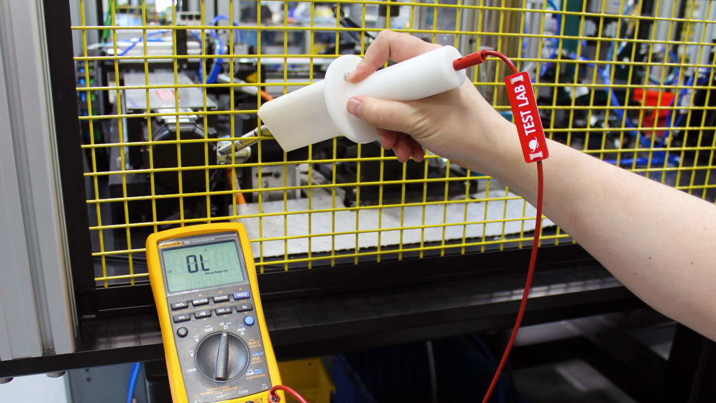 Shown in this photo is a multimeter, which is hooked up to custom ingress test equipment, design by SIGMADESIGN engineers.