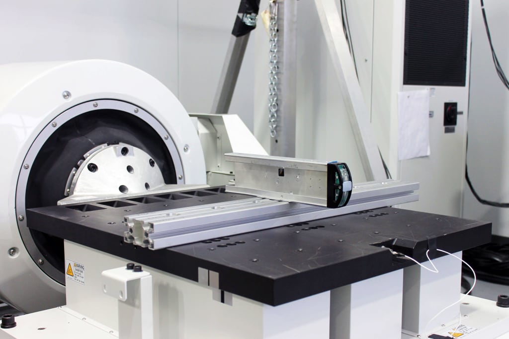 This photo shows SIGMADESIGN vibration table, custom fixture, and product being tested