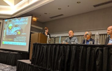 Bill Huseby speaks on panel at the Manufacturing Symposium in Portland, Oregon