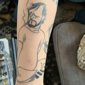 tattoo cartoon drawing of Stephen Sondheim