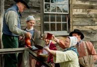 Villagers gather at the Genesee Country Village brewery to fill their containers, as the historic village is busy Preparing for the Holidays—the 19th-Century Way on Nov. 24.