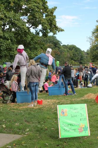 Scarecrow stuffing at Harvest Fest in Rockford, Michigan