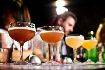 Bartenders serving cocktails
