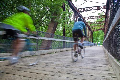 Biking across bridge in Grand Rapids