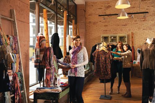Shoppers browse clothing goods at Lee and Birch
