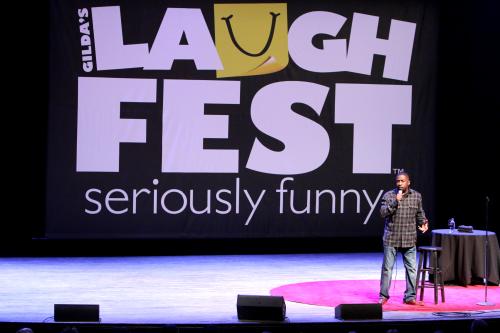 Gilda's LaughFest Comedian performing on stage