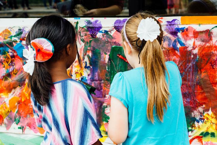 Girls painting during Children's Museum ArtFest in Grand Rapids, Michigan