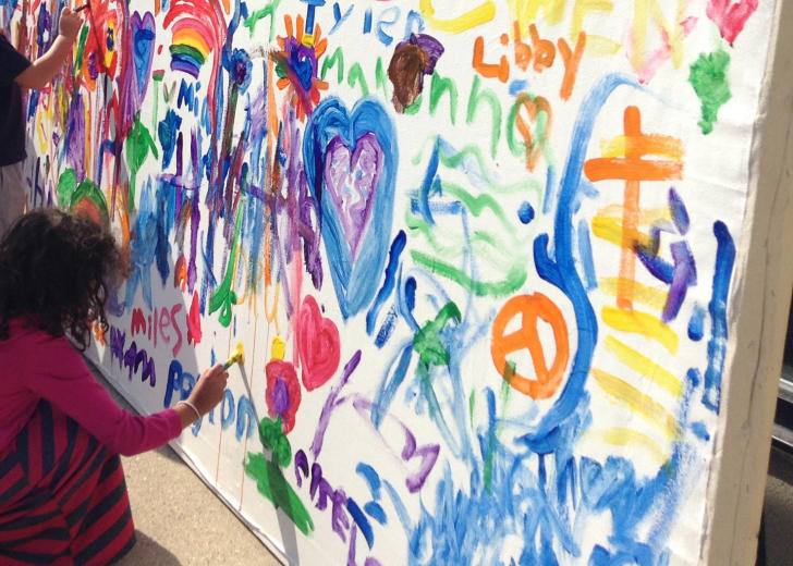 Kid painting at Children's Museum ArtFest in Grand Rapids