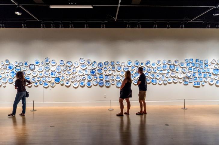 People studying The Last Supper wall piece by Julie Green at ArtPrize