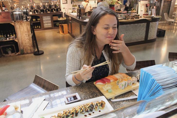 Woman dining at Sushi Market in Downtown Market Grand Rapids