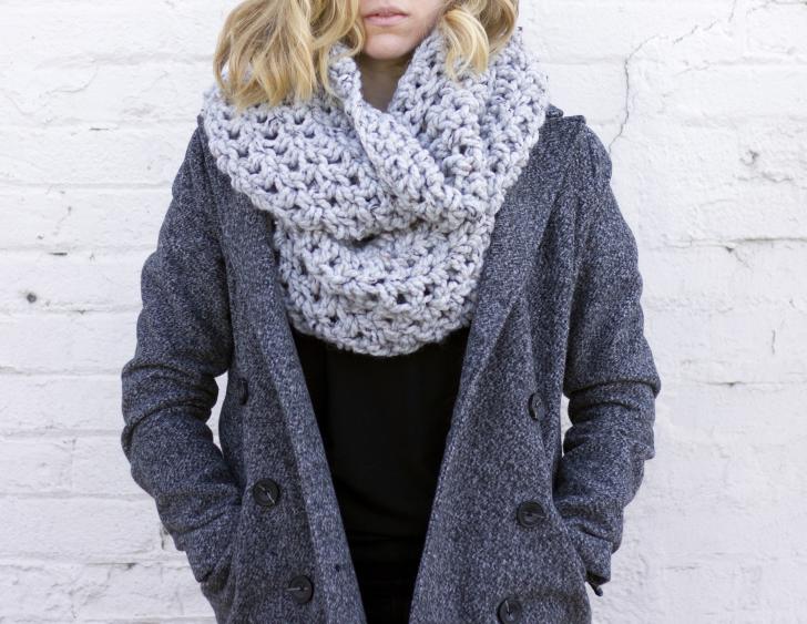 Model wearing scarf and jacket from Dime and Regal in Grand Rapids