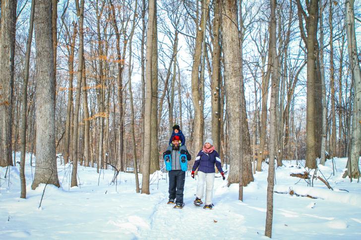 Family snowshoeing at Blandford Nature Center in Grand Rapids