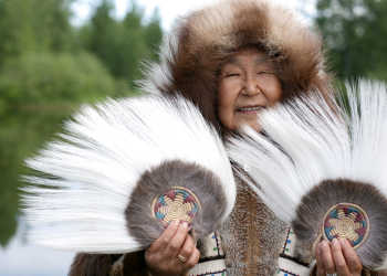 Alaska Native people; woman with fans