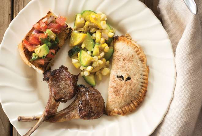 Empanadas cap a meal of lamb chops, beans, calabacitas, and pico de gallo