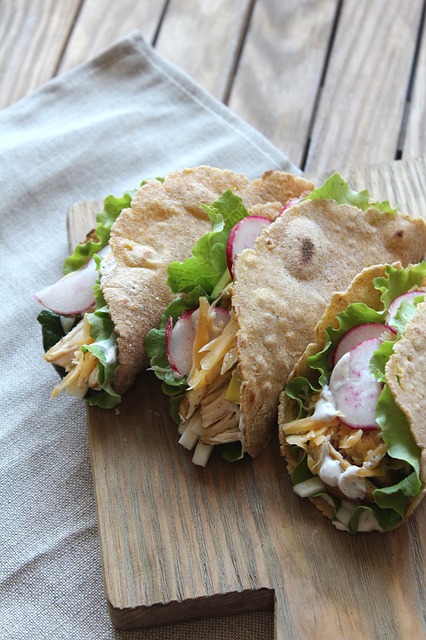 Delicious tacos served with sour cream and guacamole