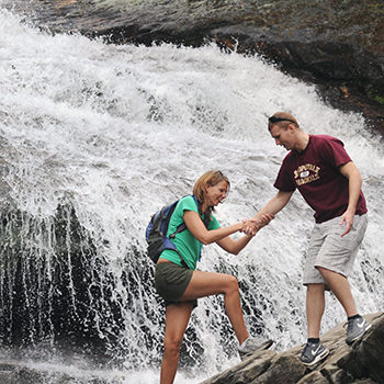 A couple at a waterfall on the Blue Ridge Parkway