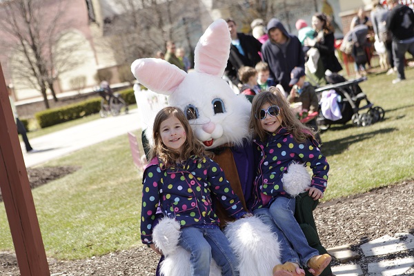 Getting a photo with the Jefferson Pointe Easter Bunny Two girls have their picture taken with the Easter Bunny at Jefferson Pointe