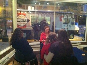 A group of friends gather at Founders co-working space in downtown Fort Wayne