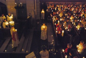 The St. Lucia processional at Trinity English Lutheran is beautifully illuminated by candlelight.
