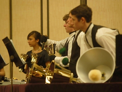 3 Handbell Musicians performing