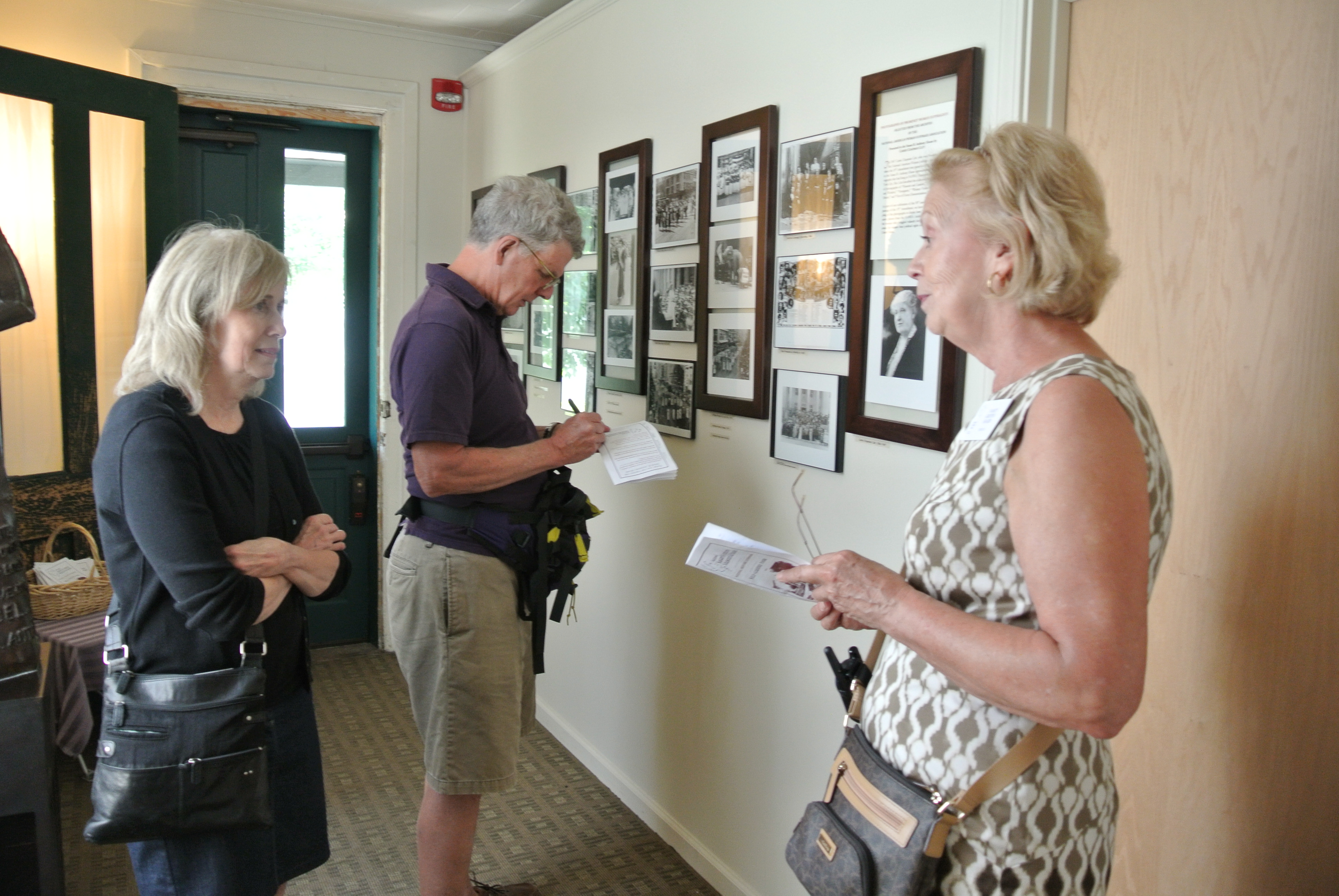 a tour group learns about womens history at the Susan B. Anthony House